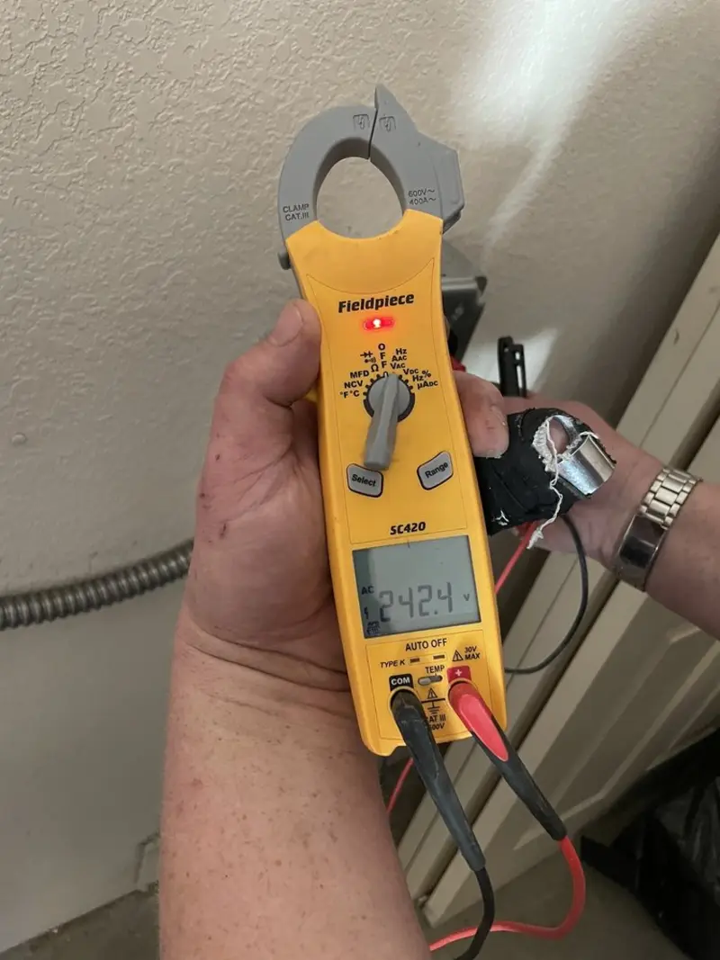 Voltage testing with clamp meter during Electrical Installation Services in Holden